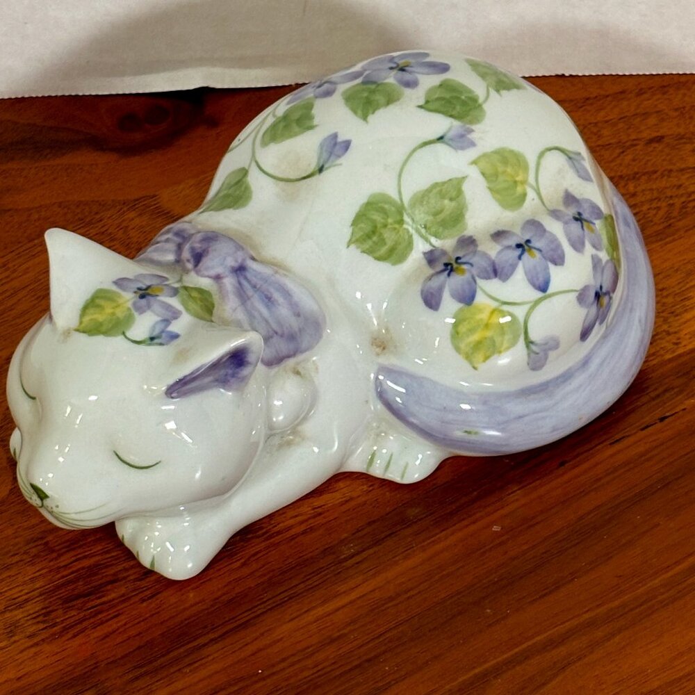 Beautiful Purple pansy sleeping cat